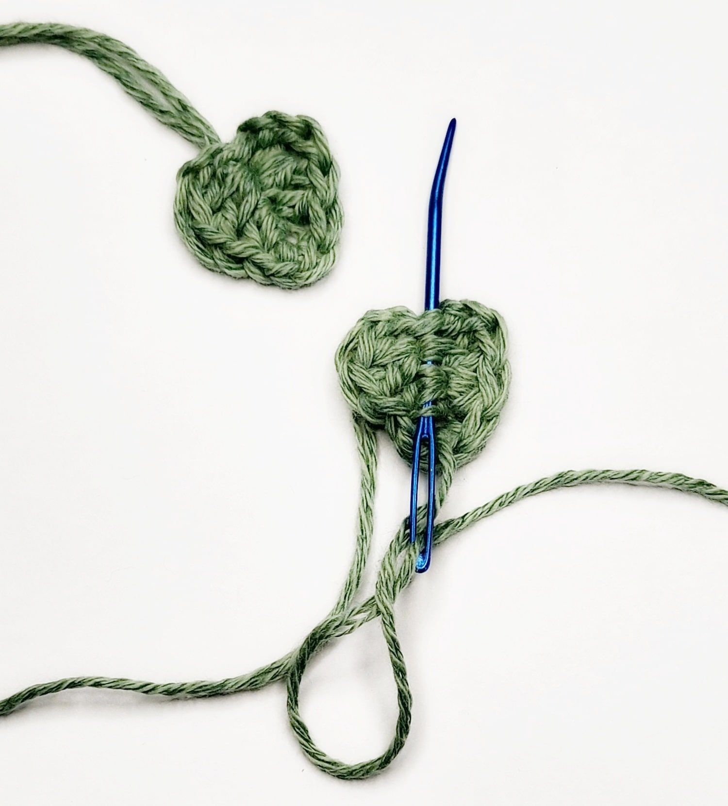 Sew tail up the spine of the leaf